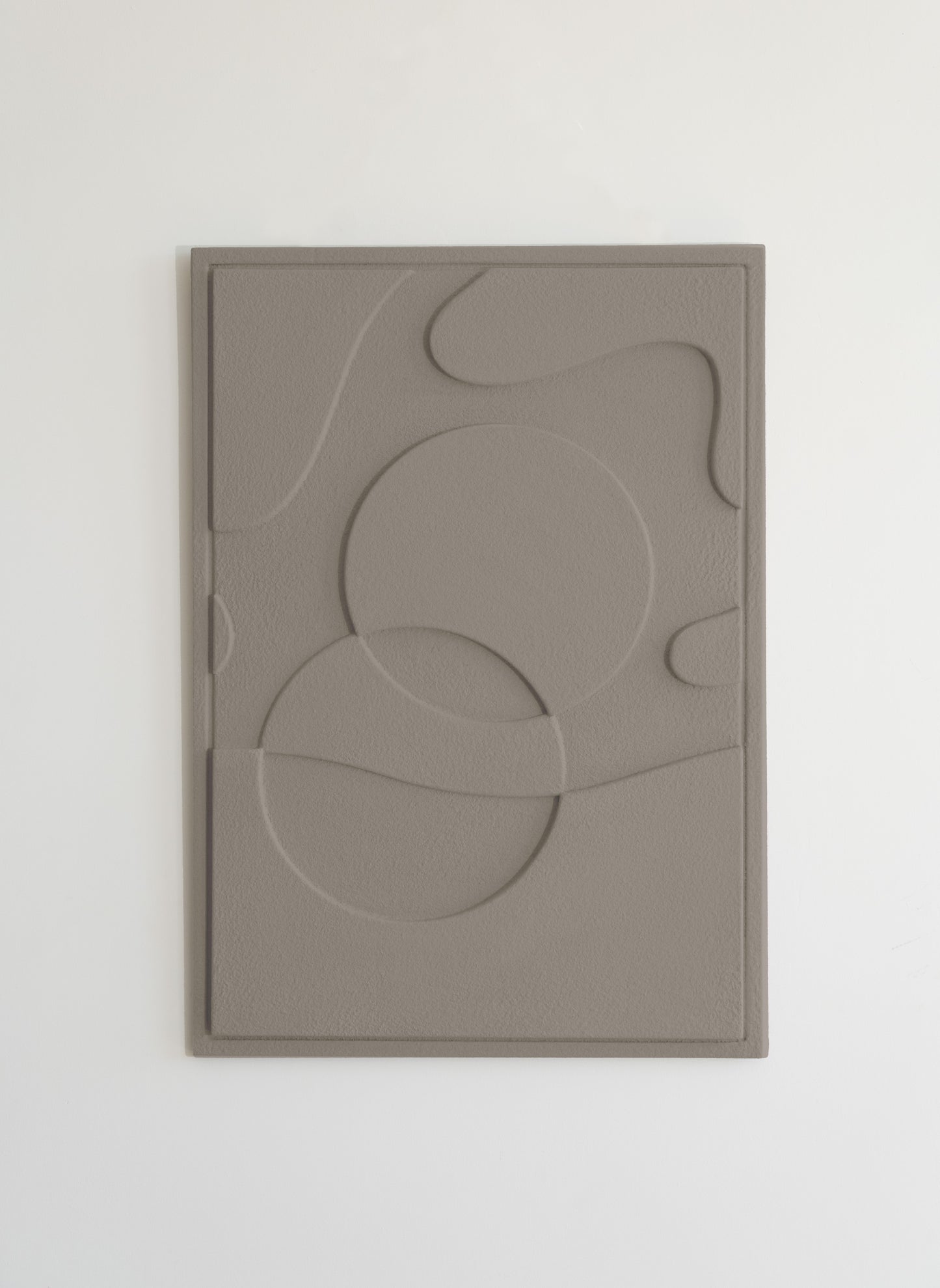 Handcrafted ETHER Relief - sustainable clay plaster wall art symbolizing harmony and universal connection.